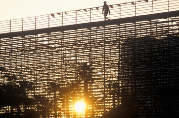 A silhouette of a person walking on the bleachers at the Toyota Grand Prix Race at the Indy Car...