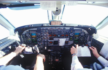 The cockpit and the pilots in a commuter airplane