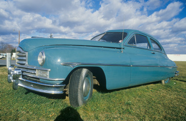 An old light blue car