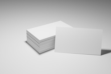 Blank white business cards on a white background without text.