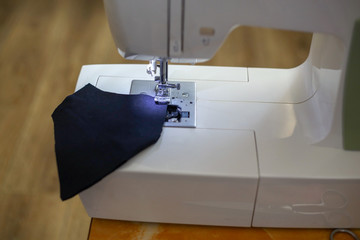 Process of sewing a fabric mask. Sewing a cotton face mask. Home production