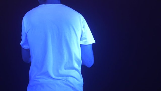 White rapper with a cap on festival stage