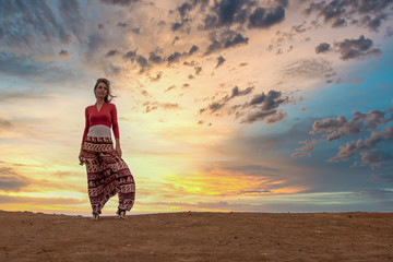 Woman and Dramatic Sunset in Peru