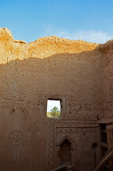 window in a mud wall in Riyadh, Saudi Arabia