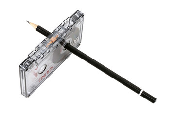 Audio tape with manual rewinding of the film with a pencil