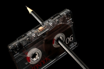 Audio tape with manual rewinding of the film with a pencil
