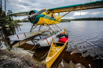 canoe and float plane on a lake