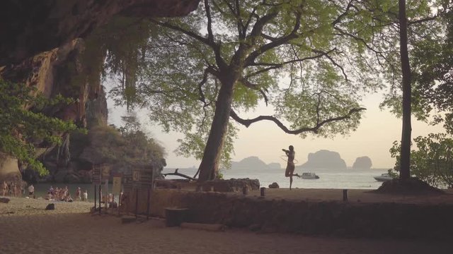 beautiful women dancing on beach Thailand vacation holiday green tree, musical lady circle, stripe bikini 4k amazing dance  bikini