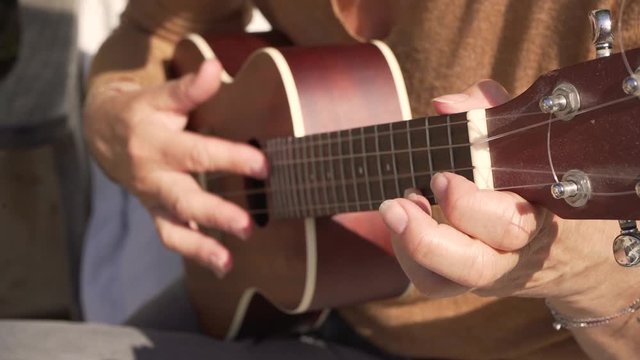 Ukulele practice, hands on ukulele