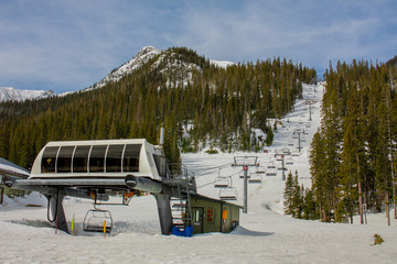 Empty chairlift in Taos Ski Valley in Taos, New Mexico on a sunny day
