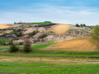 Plowed field view of the mountainous area in the countryside