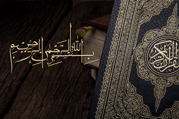 Bismillah - Mean In The Name Of Allah Arabic art  with Koran - holy book of Muslims ( public item of all muslims ) .