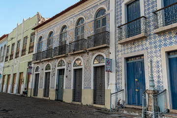 Fototapeta na wymiar São Luis, Maranhão, Brazil on August 6, 2016. Old facade of the buildings in the historic center, with windows, doors and tiles from the Brazilian colonial period
