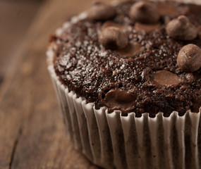 Delicious chocolate cupcake with chocolate drops. Close up