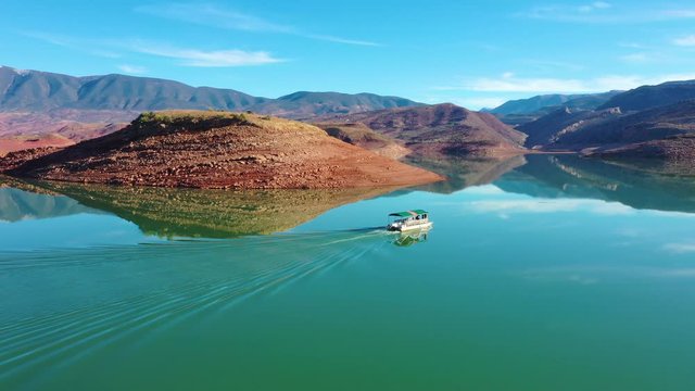 2020 - aerial over pontoon tourist boat on lake Bin El Ouidane, Morocco.