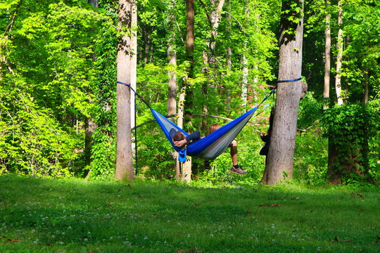 Father and kids relaxing on the hammock