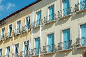 Obraz premium São Luis, Maranhão, Brazil on August 6, 2016. Old facade of the buildings in the historic center, with windows, doors and tiles from the Brazilian colonial period