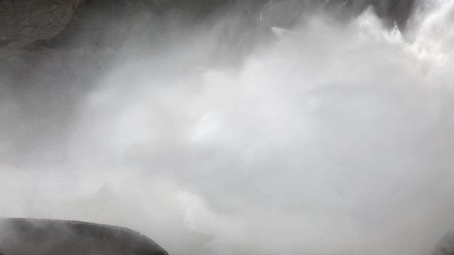 Extreme view of the water splashing in the waterfall of pailon del diablo. Extreme conditions during the largest flow in a long time in the pastaza river, Ba&ntilde;os, Ecuador.