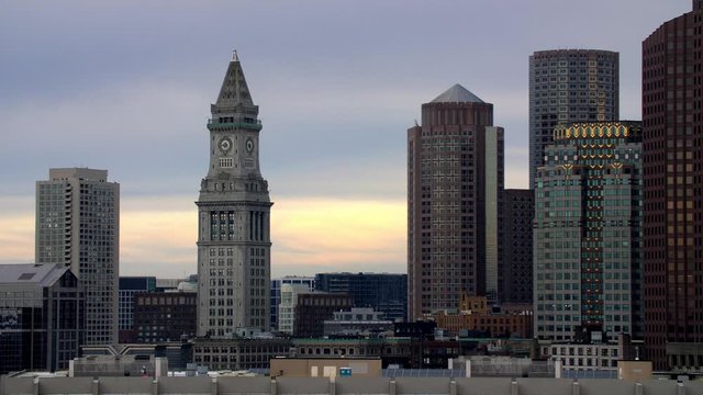 Boston Custom House Tower and other skyscrapers with lights off during the COVID-19 Pandemic at sunset, Stable shot