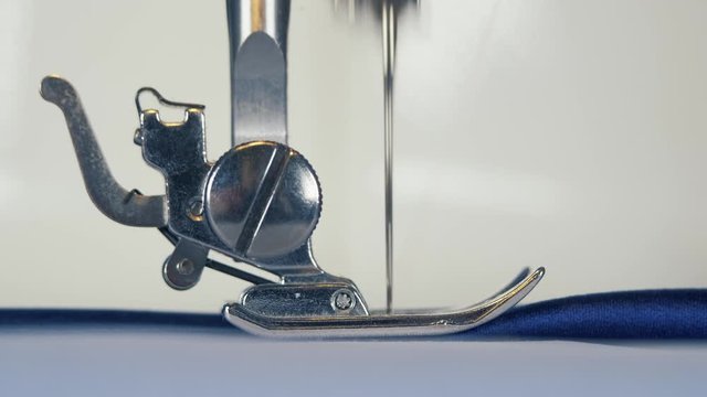 Work of the mechanical part of the sewing machine close up. Home business idea.