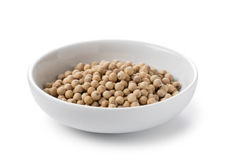 White pepper in a plate placed on a white background