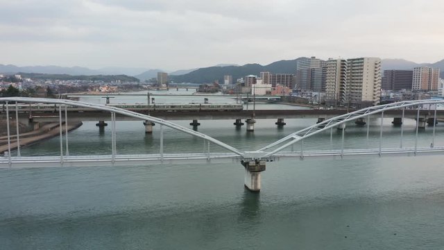 JR train crossing Seta river on Biwako line, Shiga Japan