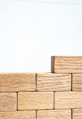Wooden blocks stacked to form a wall