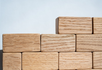 Wooden blocks stacked to form a wall