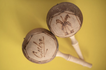 Cuban maracas. Traditional musical instrument isolated close up made of wood natural materials on...