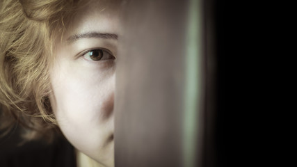 Portrait close up face of cute young asian woman looking to camera , half face of woman.
