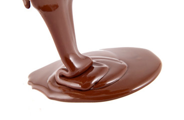 Chocolate flow isolated on white background close up
