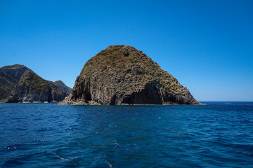 Fototapeta na wymiar View of a big cliff along the seacoast in Ponza island (Latina, Italy).