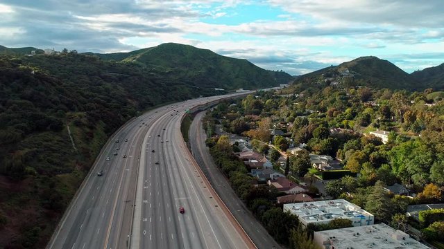 Covid-19 Coronavirus causing empty roads on Freeway-405 in Bel-Air, Los Angeles, America. Aerial drone static shot