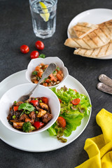 Mexican chicken stew with fresh tomato salsa and flat bread tortilla 