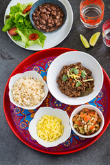 Mexican beef stew with fresh tomato salsa and corn