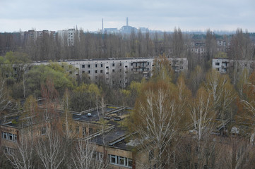 Kindergarten and houses in abandoned ghost town Pripyat in Chernobyl zone