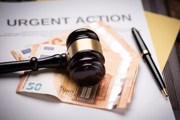 Judge s hammer gavel  and euro money on a desk