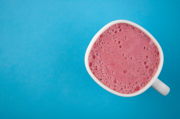 Breakfast. Healthy pink smoothie with strawberry in a white ceramic cup with berry. Fitness food.