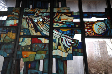 Broken stained glass window in cafe Pripyat