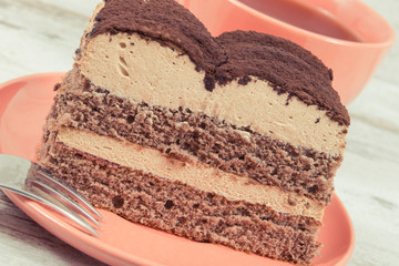 Creamy tiramisu cake with different layers and black coffee. Delicious dessert for celebrations