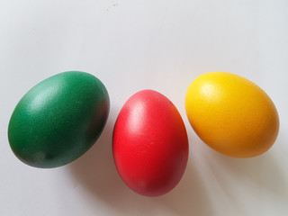 eggs red green yellow for easter in greece isolated in white background
