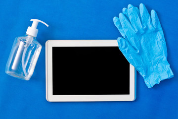 Antiseptic wiped tablet with rubber gloves - Safety concept during covid-19 coronavirus epidemic...