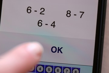 Distance learning. Home based learning online. Studying at home on the Internet.mobile phone with a math program. School program at home during caronavirus.Online learning.