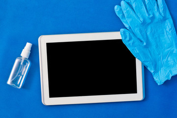 Antiseptic wiped tablet with rubber gloves - Safety concept during covid-19 coronavirus epidemic...