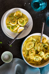 A bowl of homemade Curried egg salad with celery and green onions