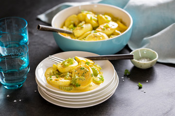 A bowl of homemade Curried egg salad with celery and green onions