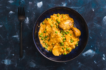 plant-based food, baked potaotes with yellow peas and peas in creamy vegan sauce