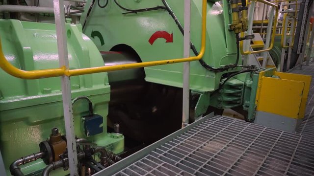 Rotating shaft line of main propulsion plant of passenger ship with intermediate bearings, sensors and pipe lines. Shaft is a link between engine and propeller which is used for ship moving