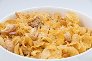 cereal in a white bowl on white background. Healthy breakfast concept.