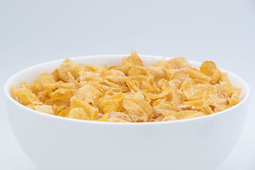 cereal in a white bowl on white background. Healthy breakfast concept.